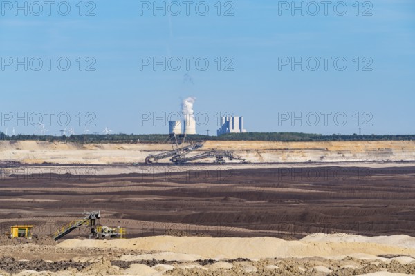Spoil heaps in the Welzow-Süd opencast lignite mine, with the Schwarze Pumpe power plant in the