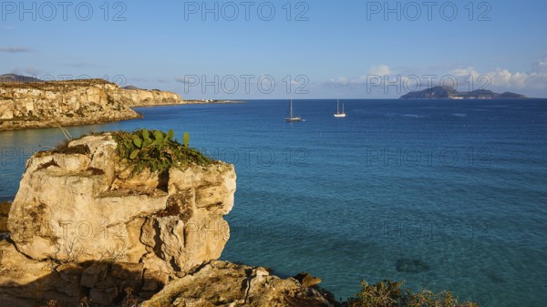 Rock, sailing boats, Levanzo Island, Scogliera di Cala Rossa, Cala Rossa, Favignana, Egadi Islands,