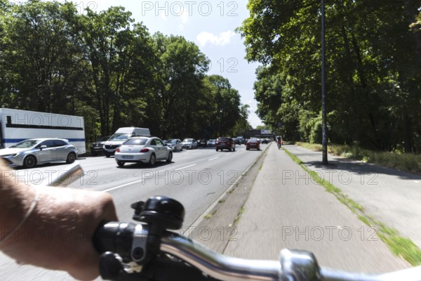 Cycling from a first-person perspective on a cycle path in Cologne, North Rhine-Westphalia,