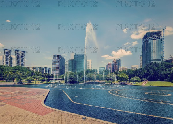Vintage retro effect filtered hipster style image of skyline of Central Business District of Kuala