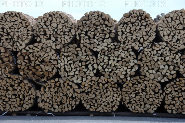 Firewood, split logs, bundled for sale