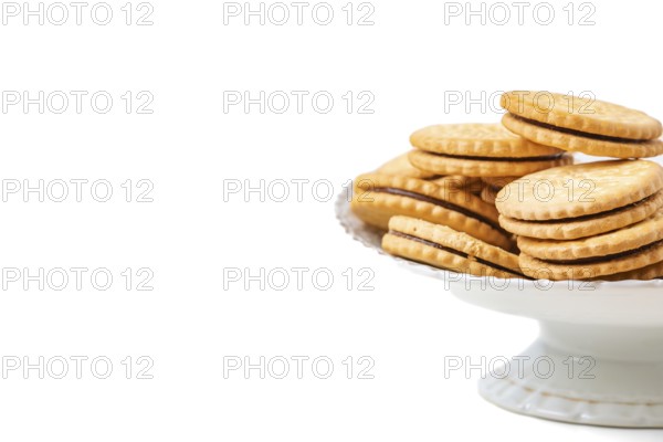 Double biscuits in white bowl, white background, copy space