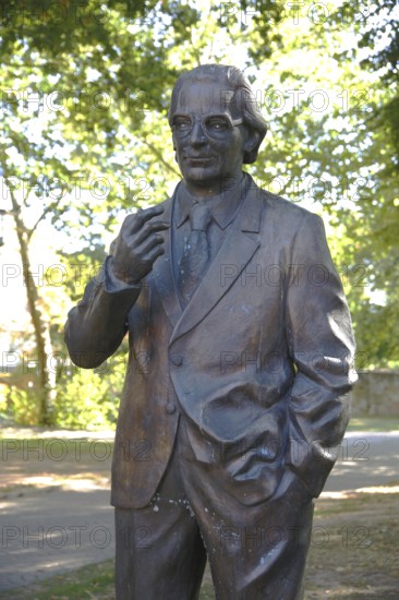 Detail of sculpture with Konrad Duden at Duden Zuse monument, statue, personality, Bad Hersfeld,