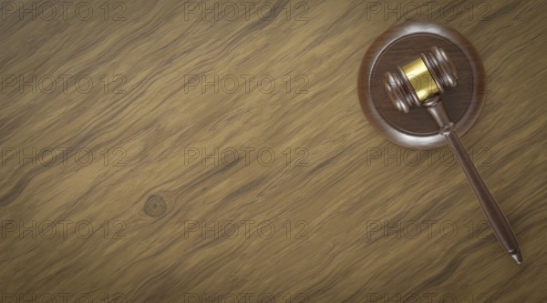 Overhead of gavel resting on a table with room for text