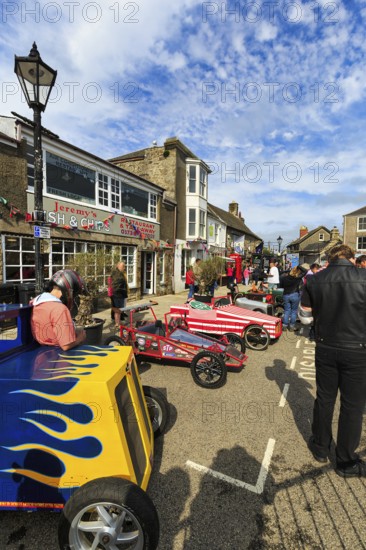 Traditional colourful soapboxes, crowd in town centre, Lafrowda Festival, St Just in Penwith,