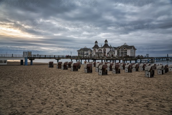 Empty beach chairs in front of the pier Sellin at dusk, long exposure, Baltic resort Sellin, Insel