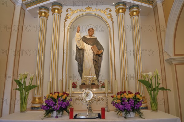 Figure of San Vicente above the altar of the Ermita de San Vicent chapel in Cautivador or