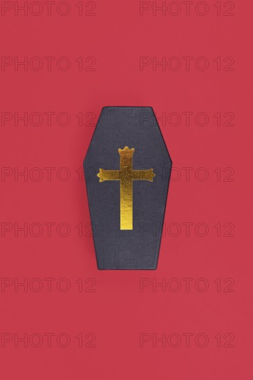 Coffin shaped Halloween cardboard gift box on red background