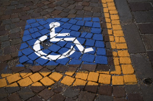 Reserved for wheelchair, severely disabled, marking on pavement, Ortisei, Val Gardena, South Tyrol,