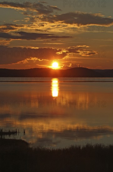 Sunset, midnight sun at a lake in Kvikkjok National Park, Lapland, Northern Sweden, Sweden,