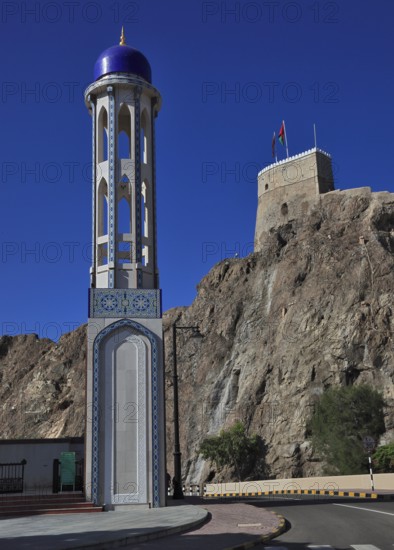Minaret of the Masjid al-Khor Mosque and Mirani Fort in Muscat, Oman, Asia