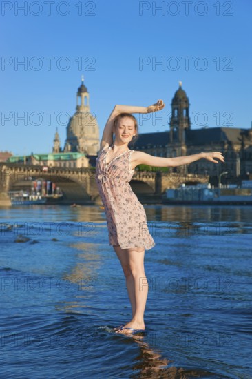 Young woman on the Elbe meadows in Dresden
