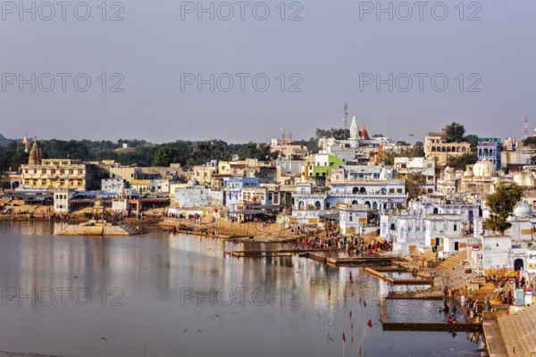 PUSHKAR, INDIA, NOVEMBER 20, 2012: Hindu devotees pilgrims bathing in sacred Puskhar lake (Sagar)