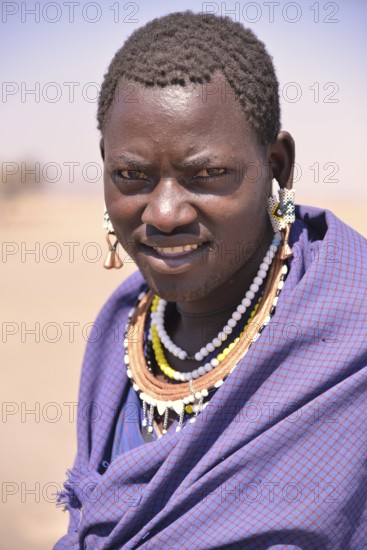 Maasai man wearing traditional dress, Ngorongoro Conservation Area, Ndema, Tanzania, Africa