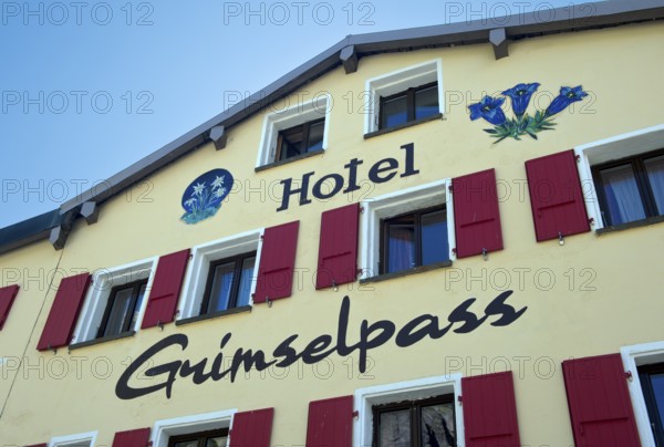 Images of edelweiss and gentian on the gable of the Berghotel Alpenlodge Grimselpass, Oberwald,