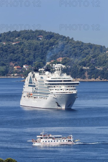 Cruise ship and boat in the sea off the Mediterranean island of Skiathos, Greece, Europe