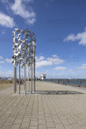Metal sculpture bird flight connected in freedom, Cuxhafen, Lower Saxony, Germany, Europe