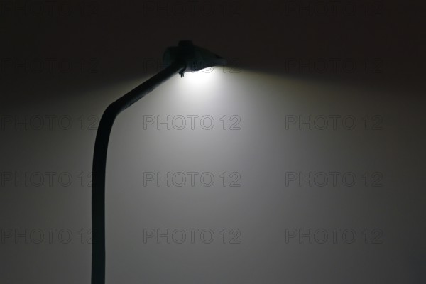 LED street lamp lights up at night