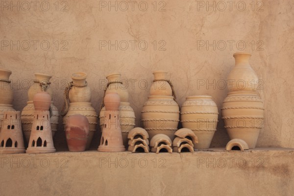Clay jars in the courtyard of Nizwa Fort. Nizwa is the centre of the Omani heartland. The oasis