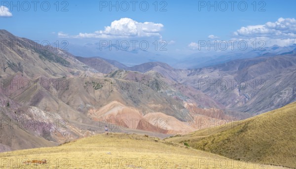 View over eroded mountainous landscape with brown hills, mountains and steppe, Chuy province,