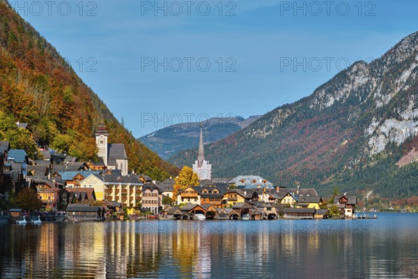 Austrian tourist destination Hallstatt village on Hallstatter See lake in Austrian alps in autumn.