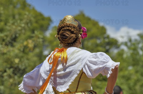 Hairdo of a woman at the annual fiesta in honour of San Vicent in Cautivador or Captivador,