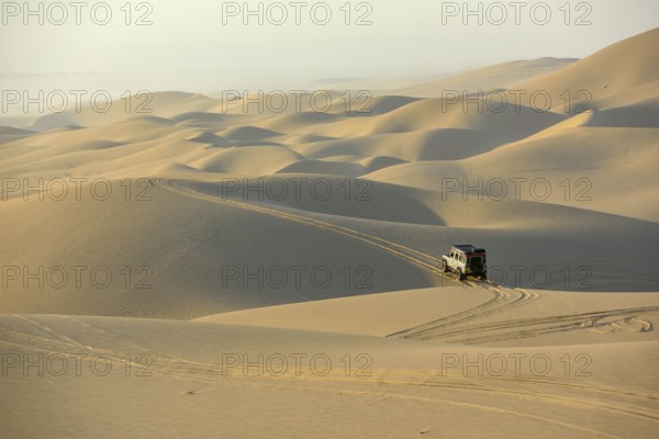 Vehicle in the dunes near Sandwich Harbour, Namib-Naukluft-Park, Namibia, Africa