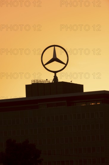 Mercedes star on Mercedes Benz branch in Stuttgart, after sunset, Baden-Württemberg, Germany,