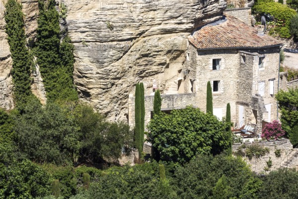 House on a rock face in the old town of Gordes, Vaucluse, Provence-Alpes-Cote dAzur, Provence,