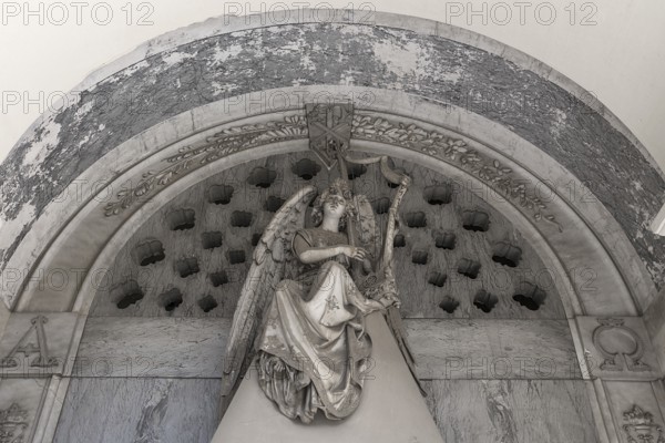Angel playing the harp, sculpture on a family tomb, Monumental Cemetery, Cimitero monumentale di