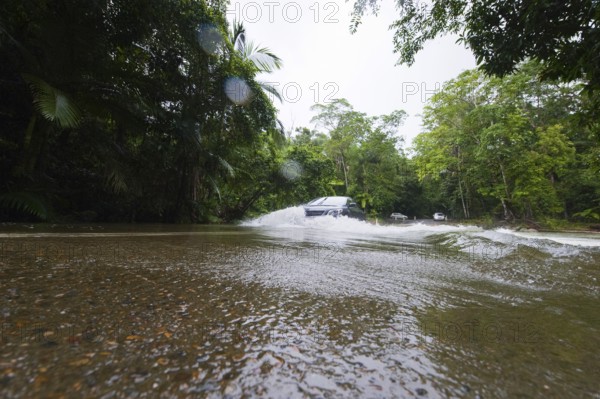 Flooded road, climate, river, rainforest, jungle, rain, flood, flooding in Daintree National Park,