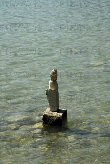 Stacked stones at sea, balance, equilibrium, equilibrium