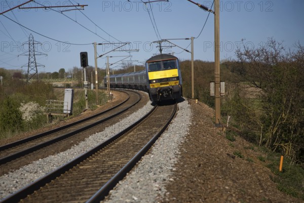 Greater Anglia Class 90 electric locomotive train on the Norwich to London line, England, UK