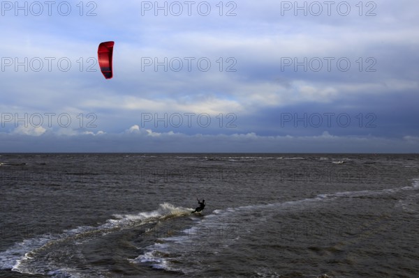 Kite surfing in North Sea at Shingle Street, Suffolk, England, UK