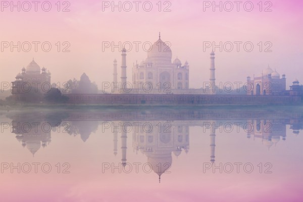 Taj Mahal on sunrise sunset reflection in Yamuna river panorama in fog, Indian Symbol, India travel