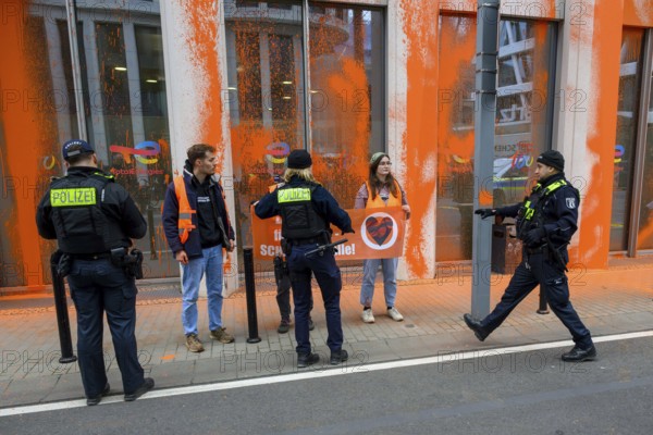 Police confiscate Last Generation banner after colour attack on Total Energies building Berlin, 06