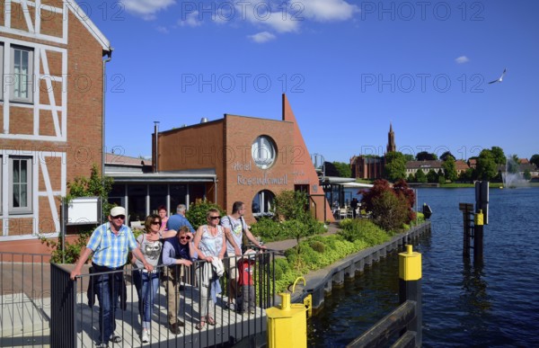 Europe, Germany, Mecklenburg-Western Pomerania, island town of Malchow, Lake Malchow, at the swing