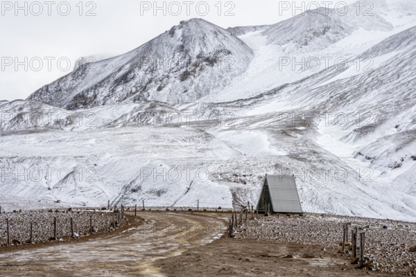 Simple restroom at the parking lot, early snow, Hveradalir geothermal area, Kerlingarfjöll,