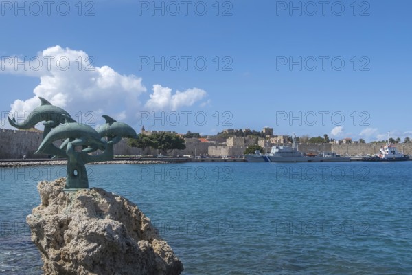 Dolphin statue in Kolona harbour, Rhodes, Dodecanese archipelago, Greek islands, Greece, Europe