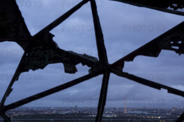 View of the city of Berlin with radio tower and television tower through a radar dome on the former