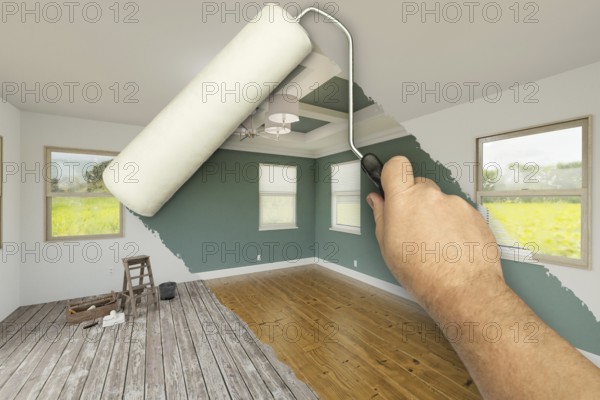Before and after of man using A paint roller to reveal newly remodeled room with fresh green paint,