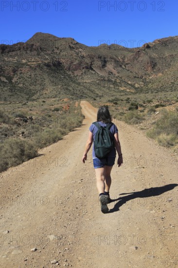 Woman walking in Cabo de Gata national park, Monsul, near San José, Almeria, Spain, Europe
