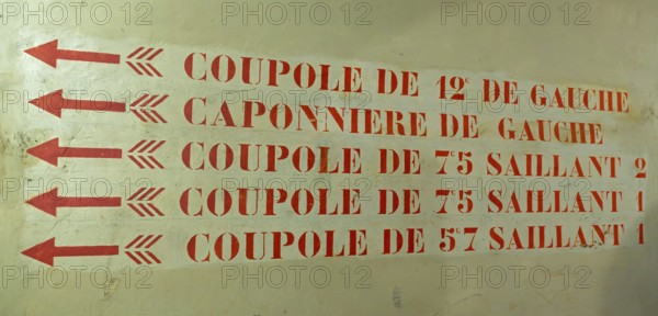 Hallway with directions for cupolas inside Fort of Liezele, fortress of the fortified area of