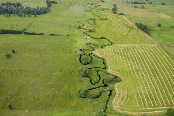 Aerial view over meander belt in meandering Klingavälsån river, tributary to Kävlingeån in the