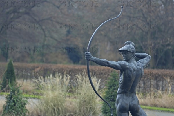 Sculpture Archer by Ernst Moritz Geyger 1895, athletic male figure with bow, bronze sculpture,