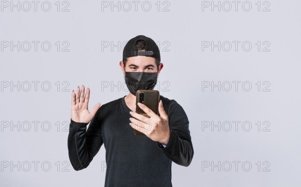 Man making video call isolated, guy making video call with face mask, face mask video call concept