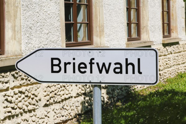 Postal voting sign, signpost for postal voting, writing, letters, information board, behind