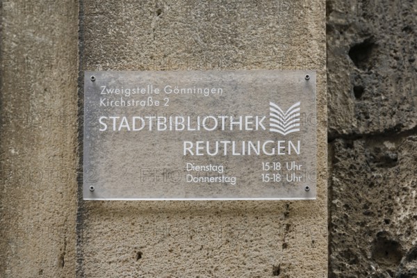 Sign on the old schoolhouse, building from 1867 made of Gönningen tuff, former elementary and