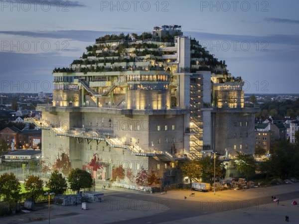 Aerial view of the Hamburg Bunker with green terraces and modern architecture in the evening