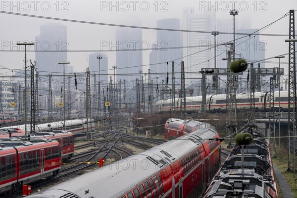 Railway tracks with regional and long-distance trains, ICE, after freezing rain, in front of